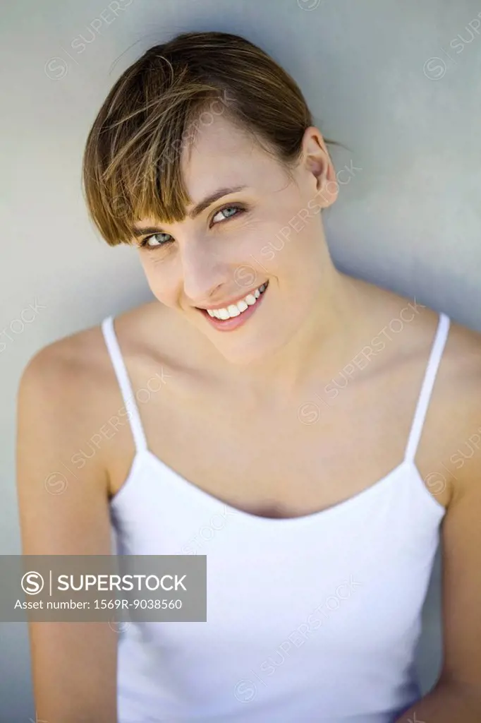 Woman smiling at camera, portrait, high angle view