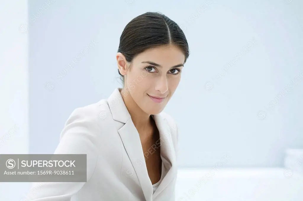 Professional woman smiling at camera, portrait