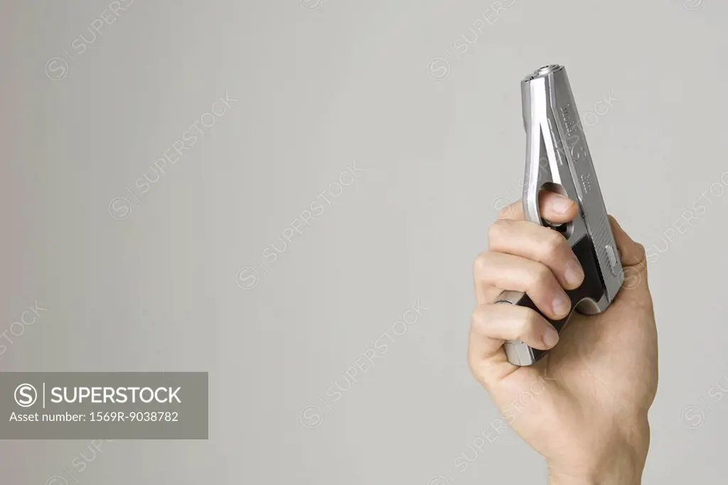 Hand holding pistol