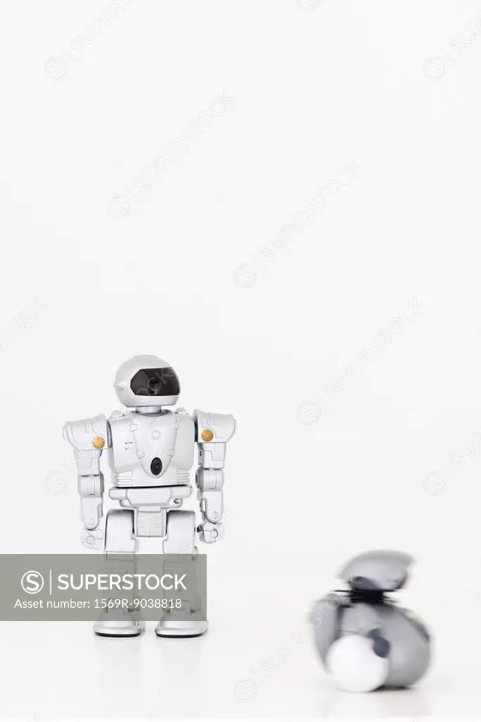 Toy robots, one in motion