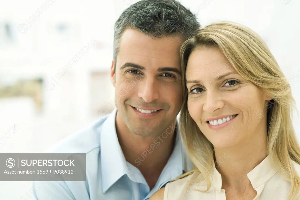 Couple smiling at camera, portrait