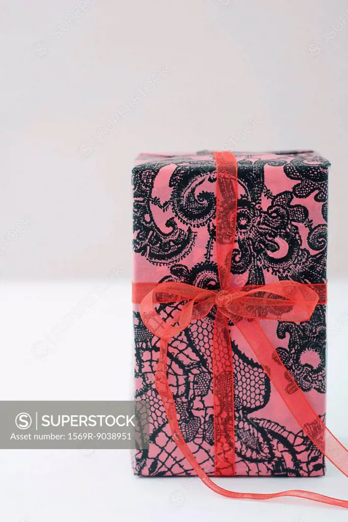 Gift wrapped present standing on end