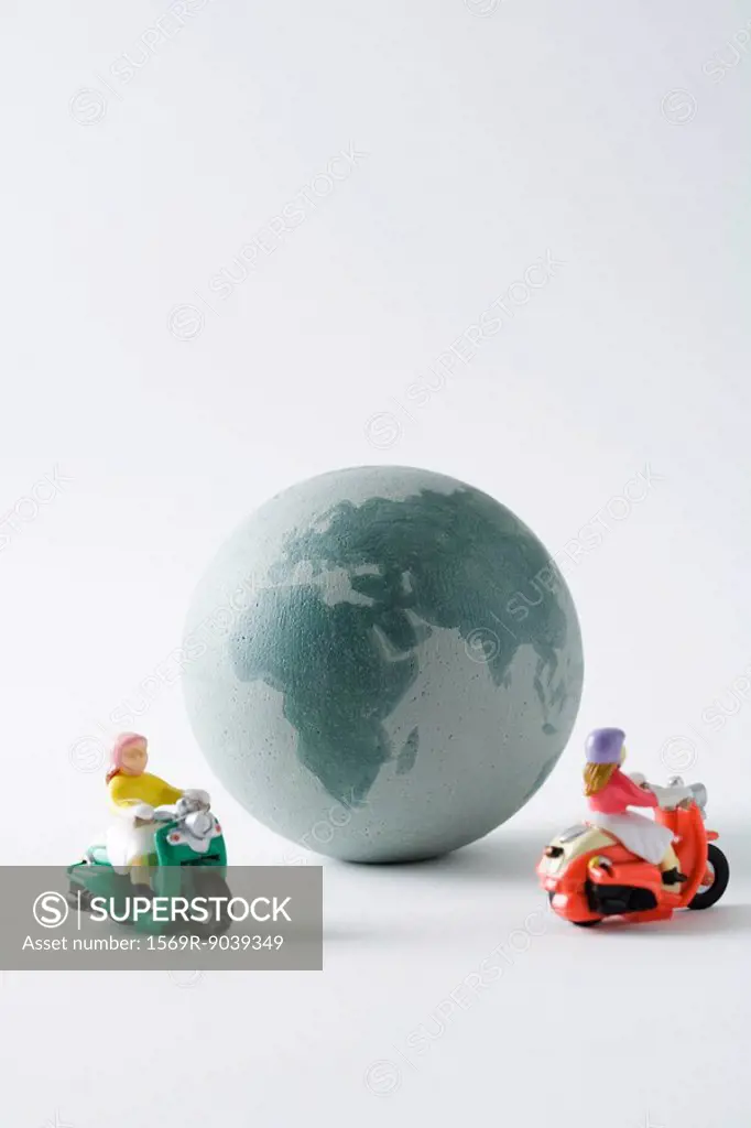 Miniature mopeds circling globe