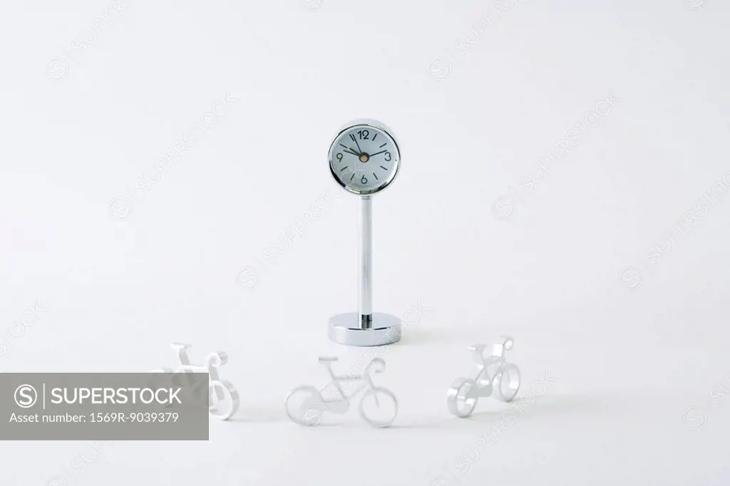 Miniature bicycles riding around clock