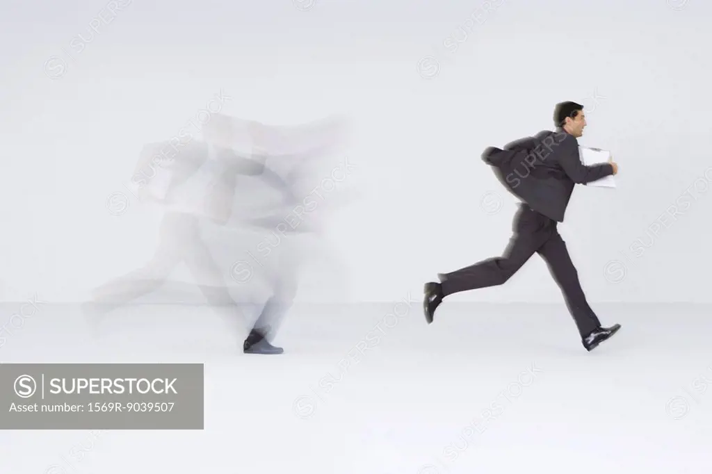 Businessman running with document