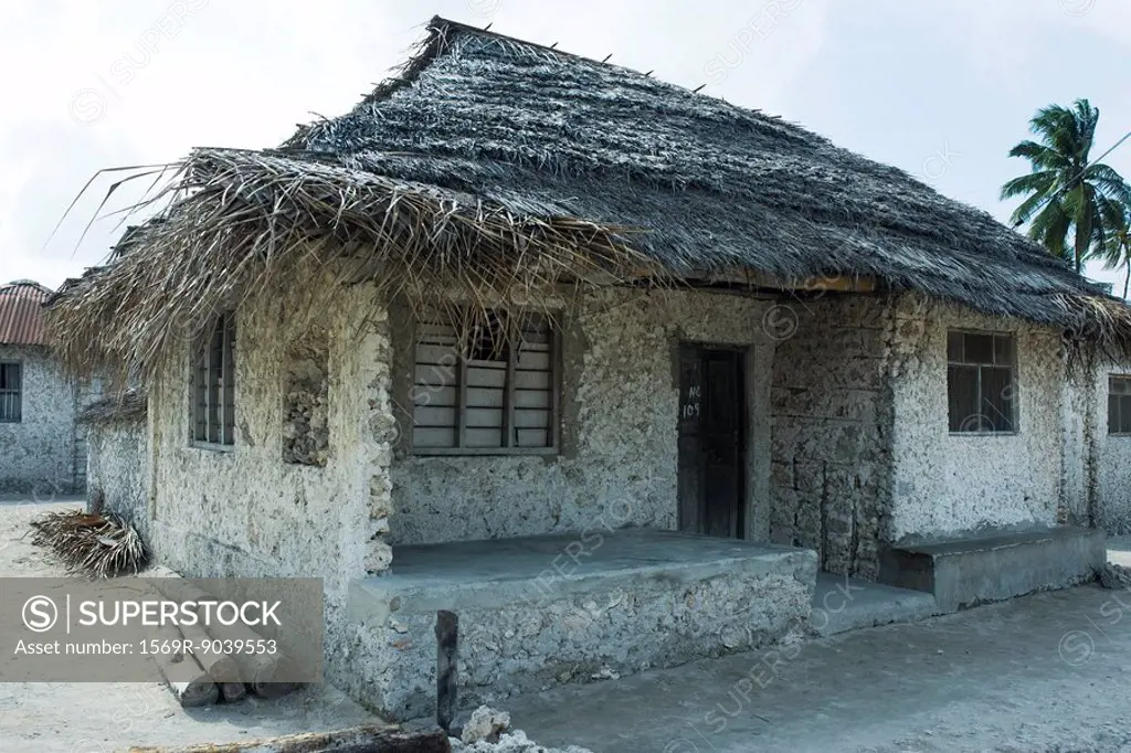 Tanzania, Zanzibar, house made of stone with thatched roof