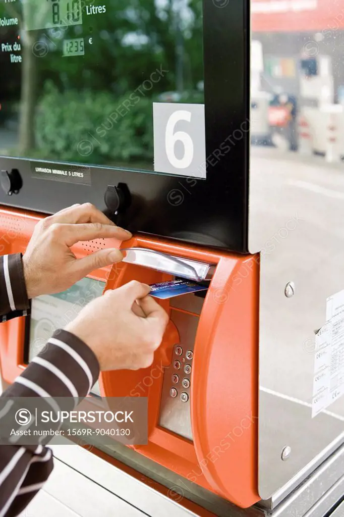Paying at the gas pump, using credit card reader
