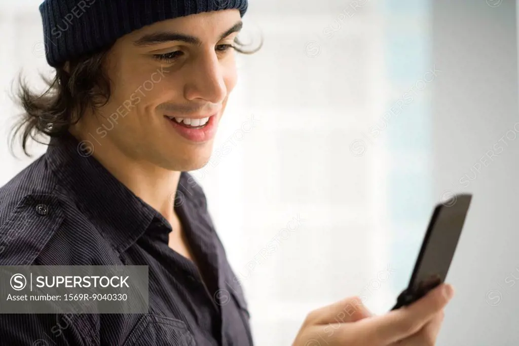 Young man text messaging