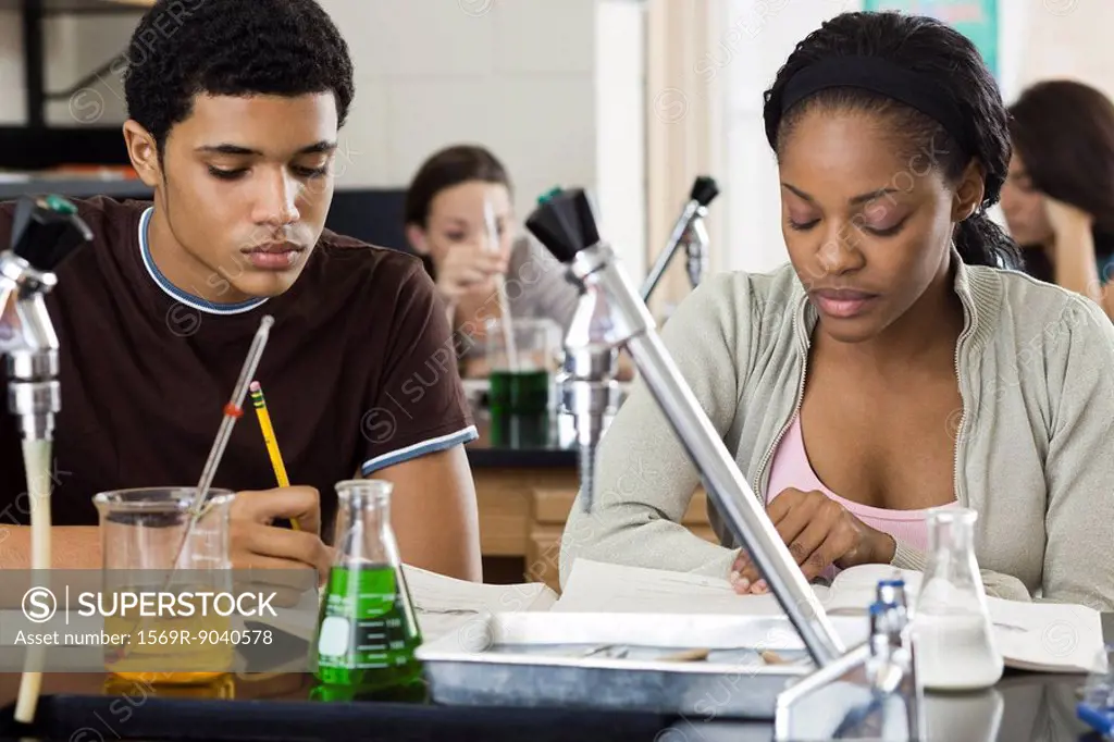 Students completing assignment in chemistry class