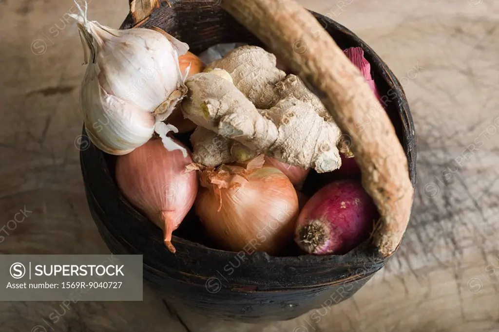 Onion, garlic, and ginger root in basket
