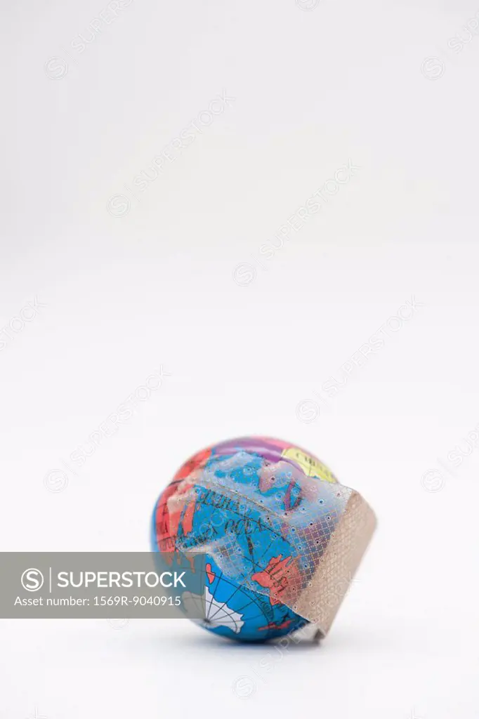 Adhesive bandage wrapped around globe