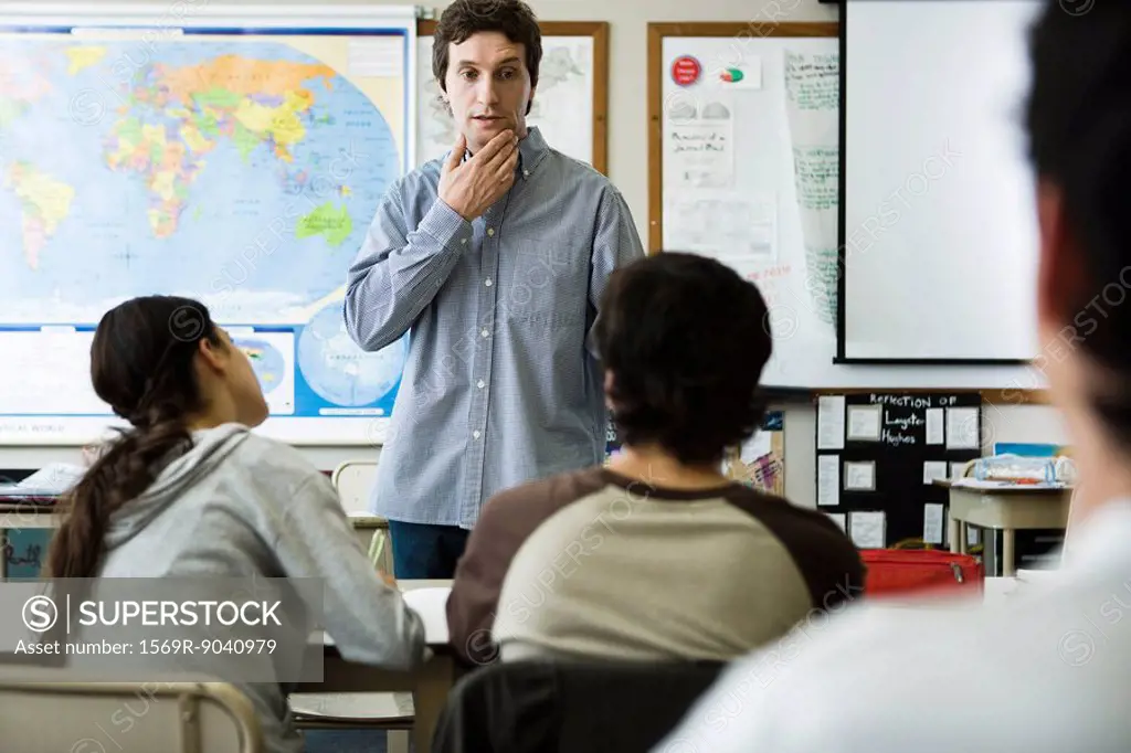 Teacher listening to student´s question