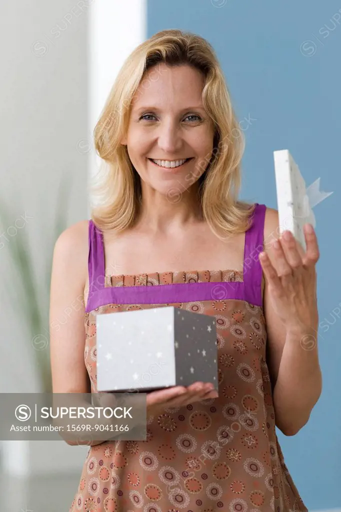 Woman opening gift, portrait