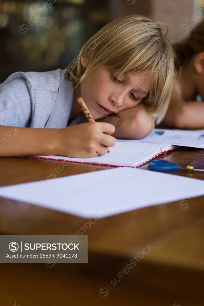 Elementary school student concentrating on school work