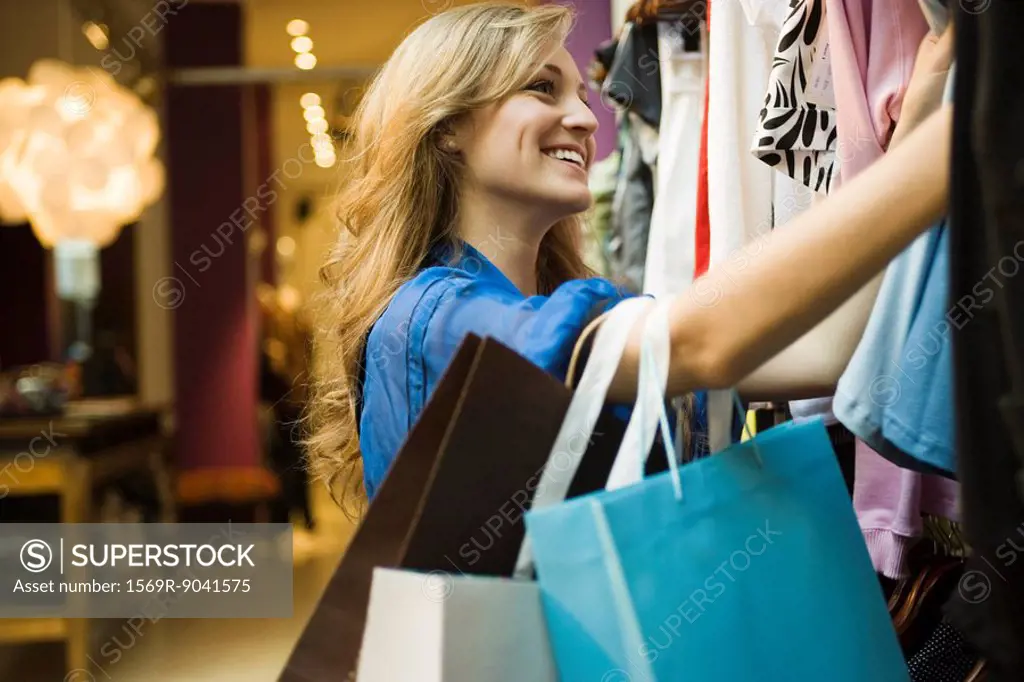 Woman shopping in clothing boutique