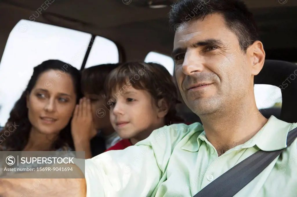 Man driving with his family