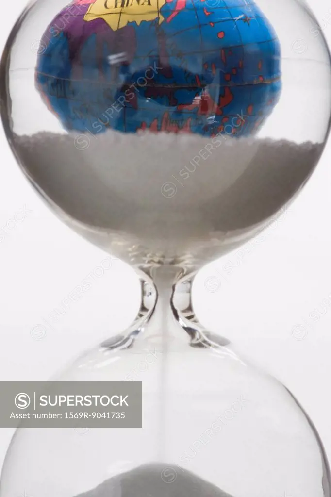 Hourglass, globe in background