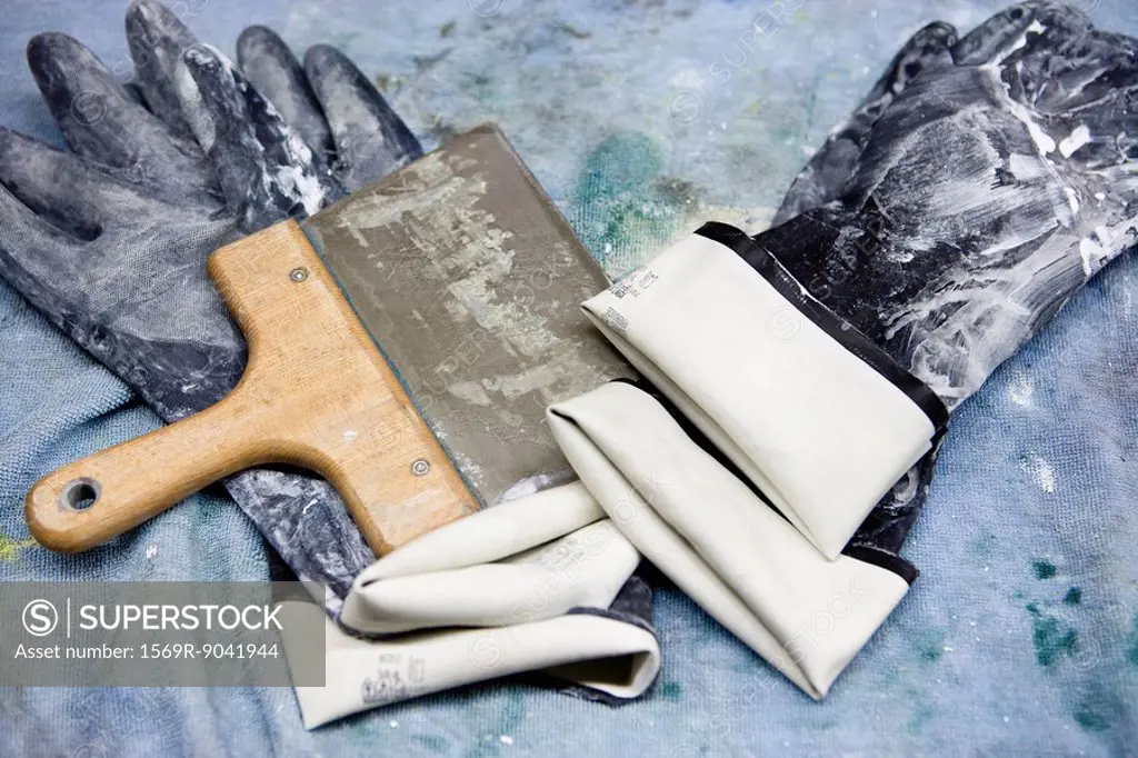 Fabric coating plant, rubber gloves and squeegee