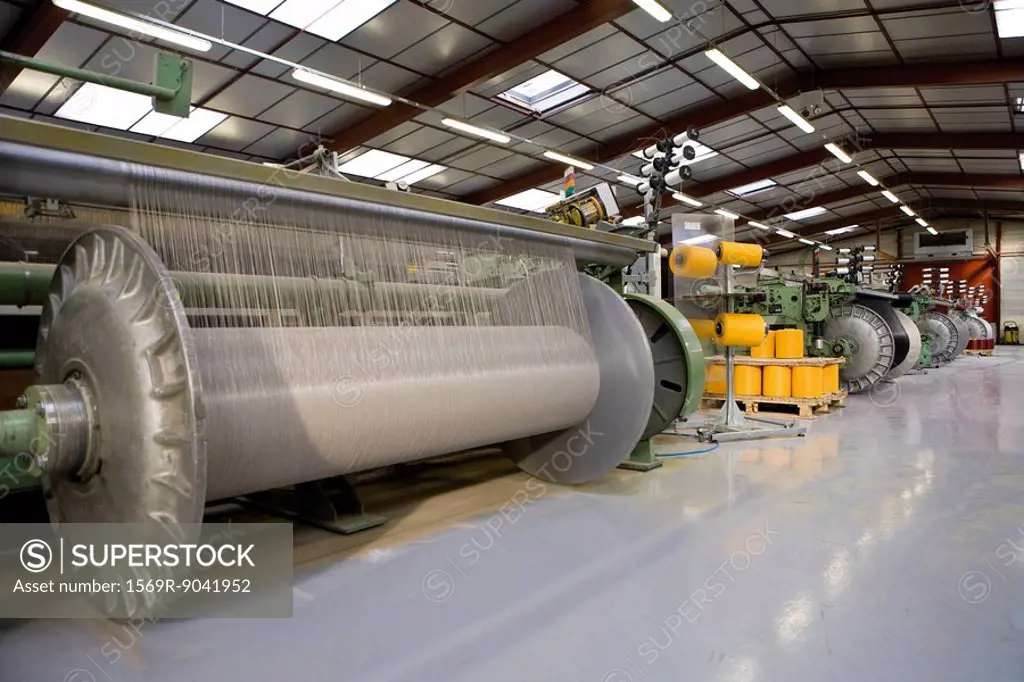 Fabric coating plant, weaving department, weaver´s beam and loom