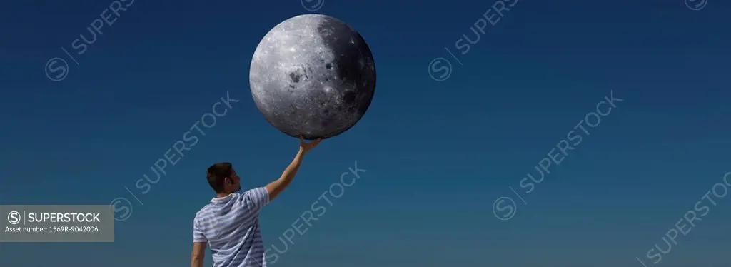 Ecology concept, man holding the moon