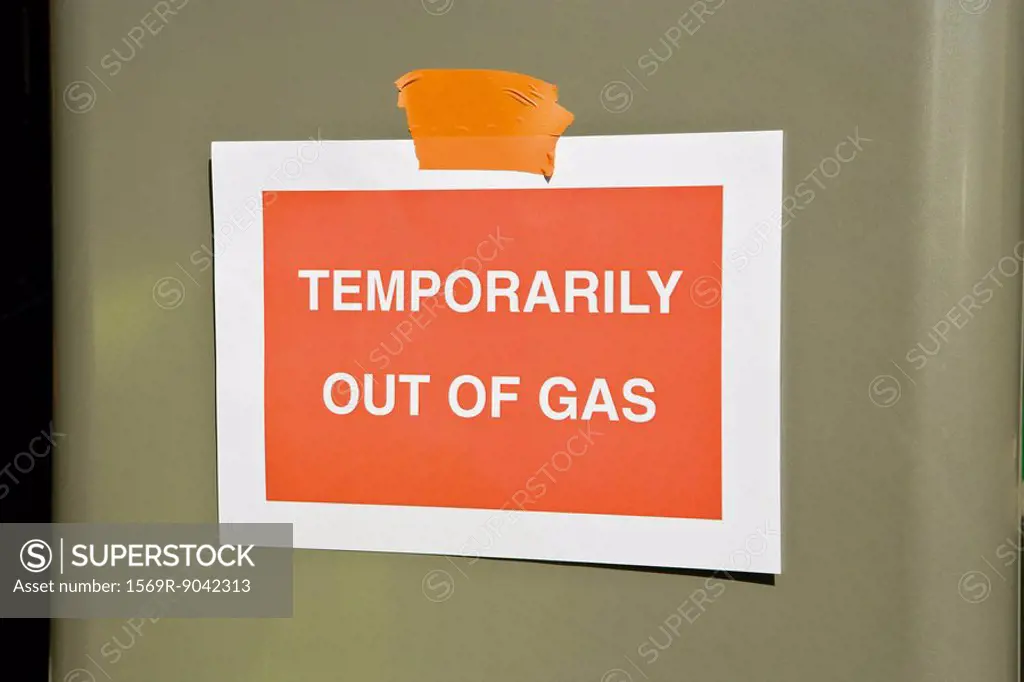 Sign at gas station reading Temporarily out of gas