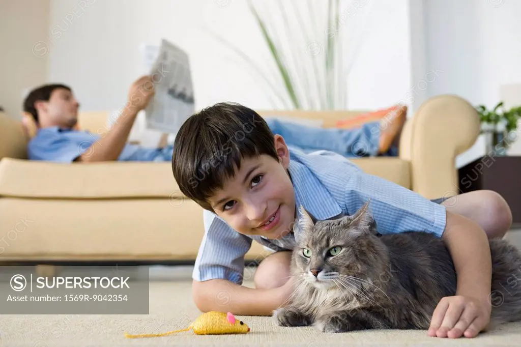 Young boy with pet cat