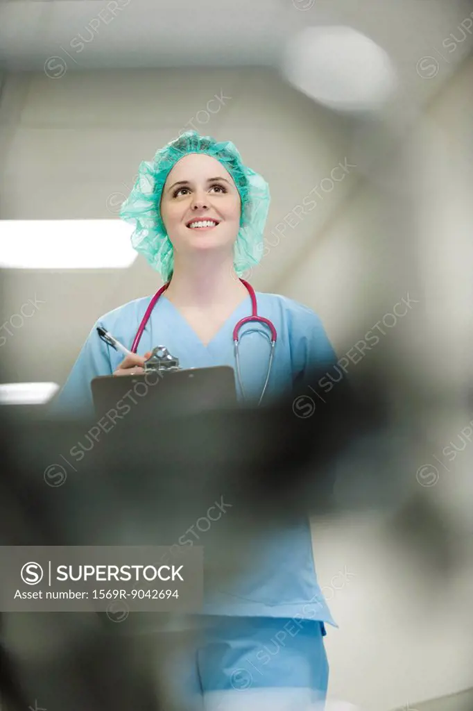 Nurse wearing surgical cap, low angle view