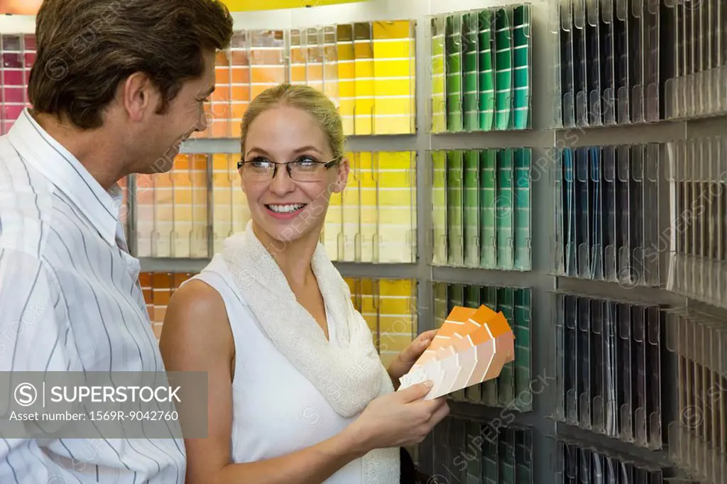 Couple looking at color swatches in store