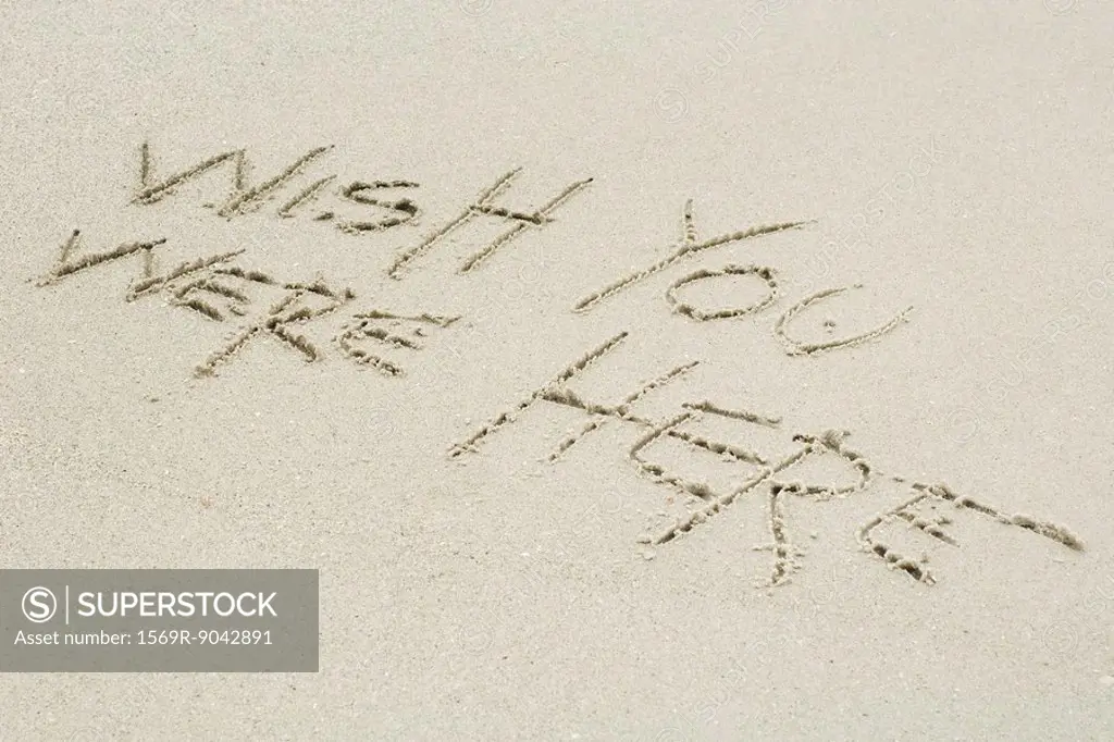 Wish you were here written in sand