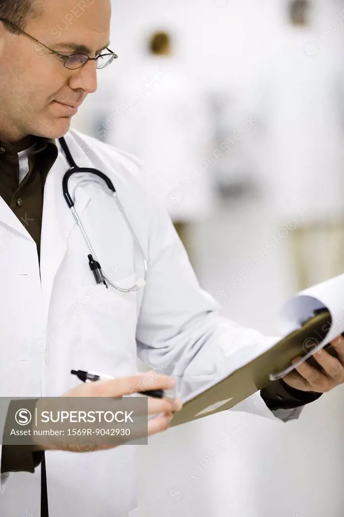 Doctor looking at medical chart