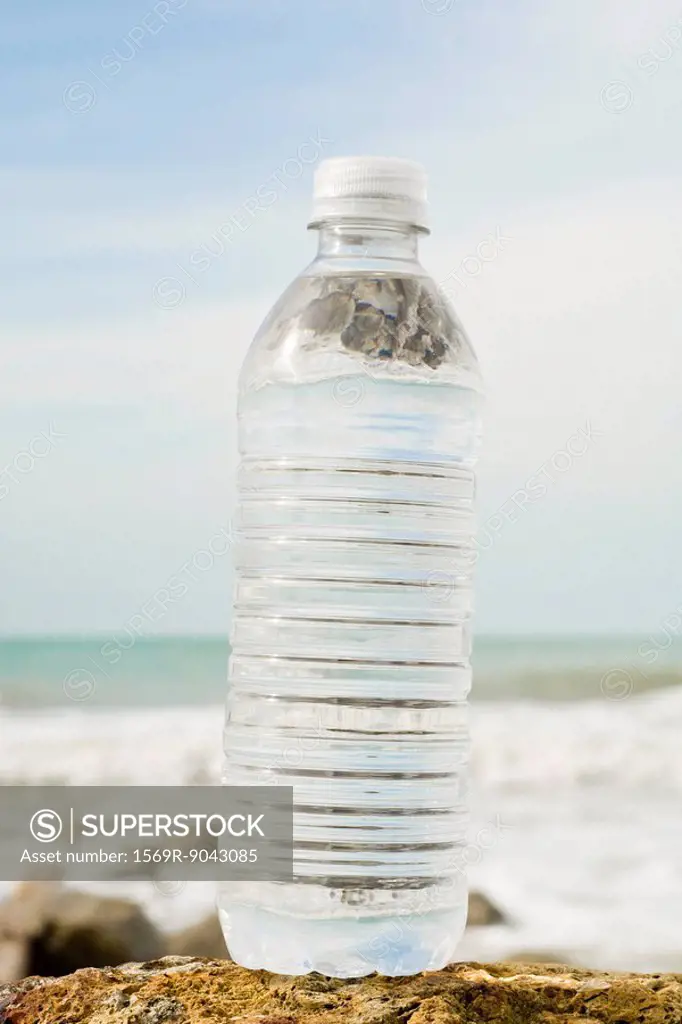 Bottle of water on shore