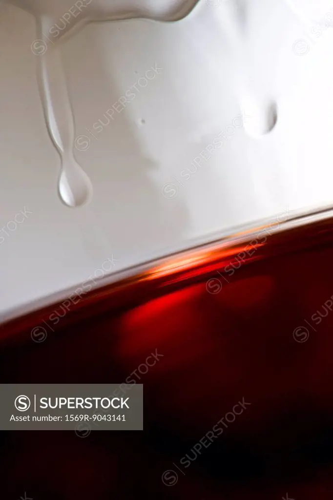 Tears of wine on glass of red wine, close_up