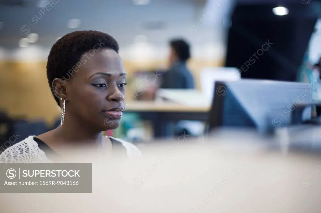 Female office worker at computer
