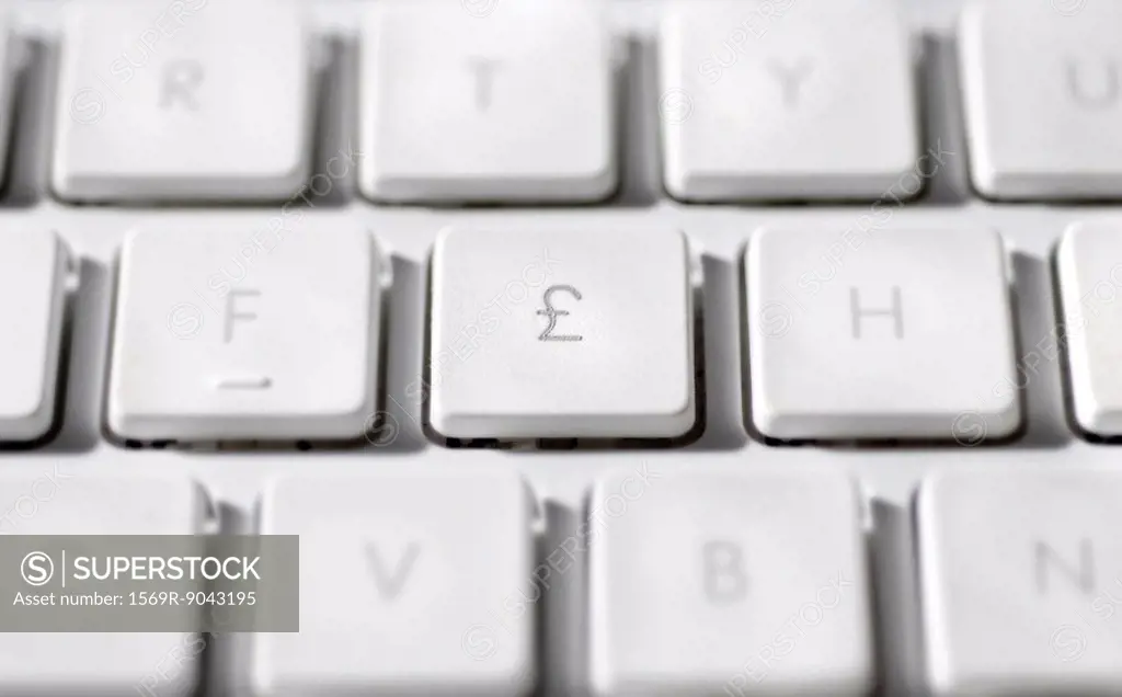 Great Britain Pound symbol on laptop computer keyboard