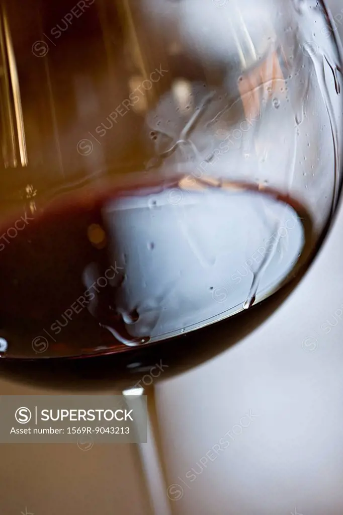 Tears of wine on glass of red wine
