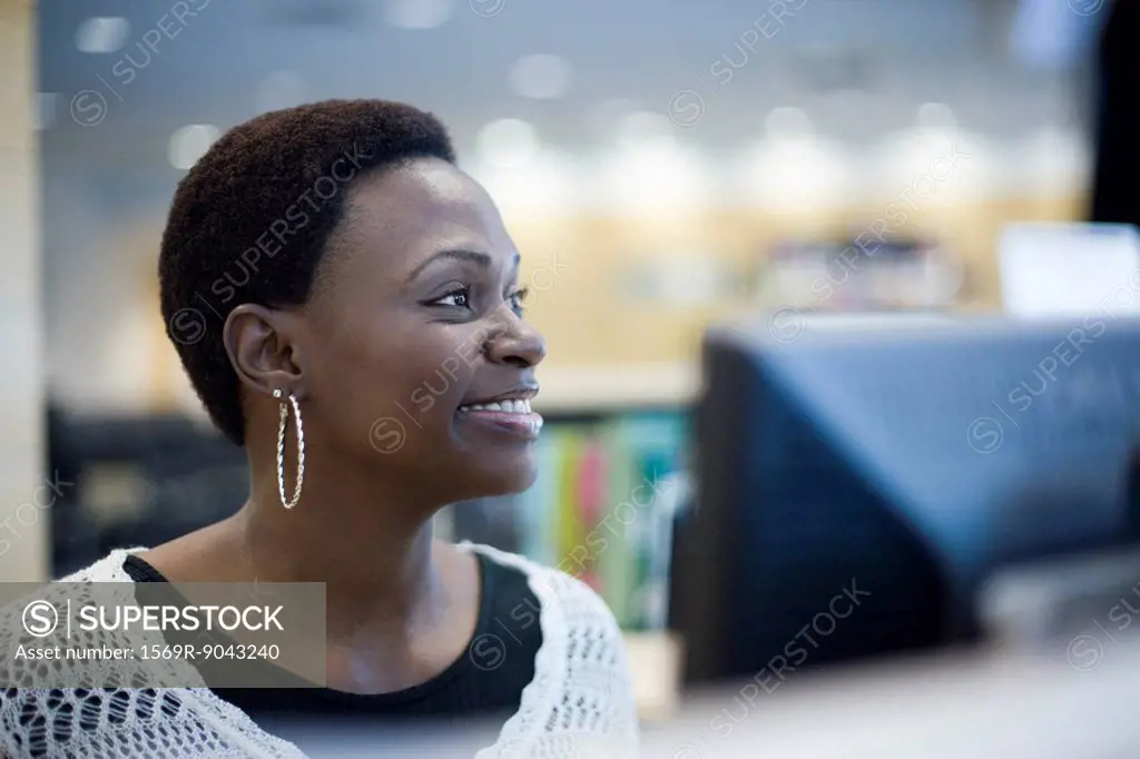 Female office worker looking away smiling