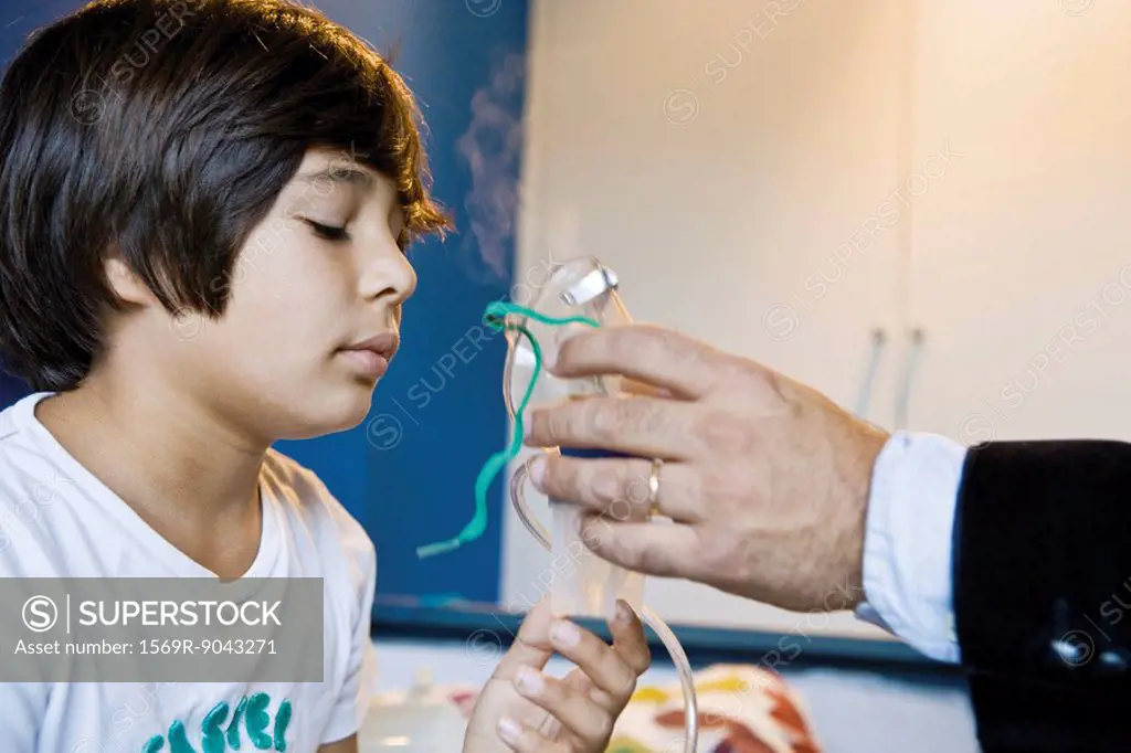 Boy receiving oxygen treatment