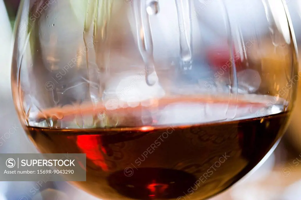 Tears of wine on glass of red wine