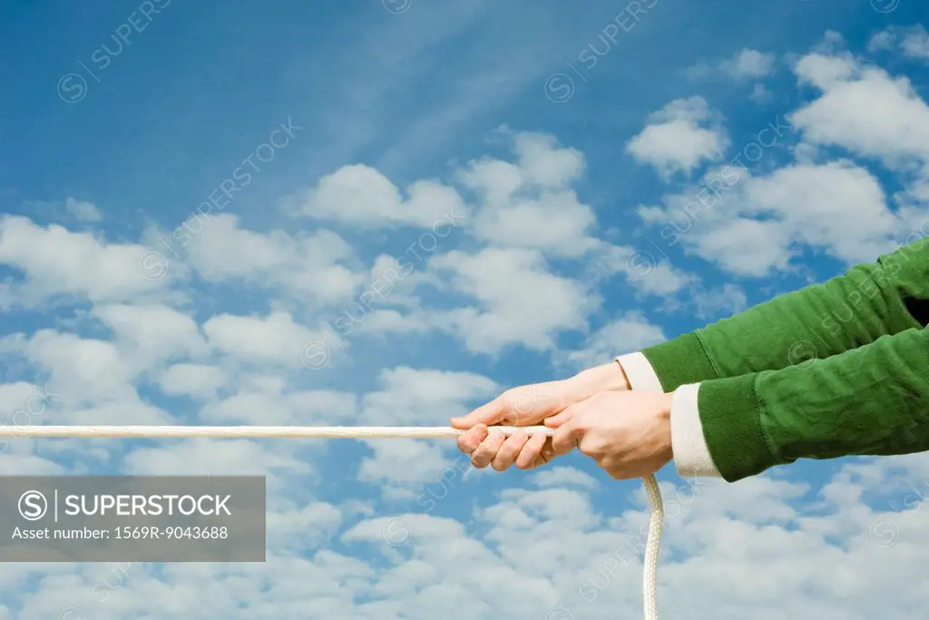 Person pulling end of rope
