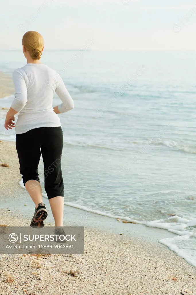 Woman jogging at the beach