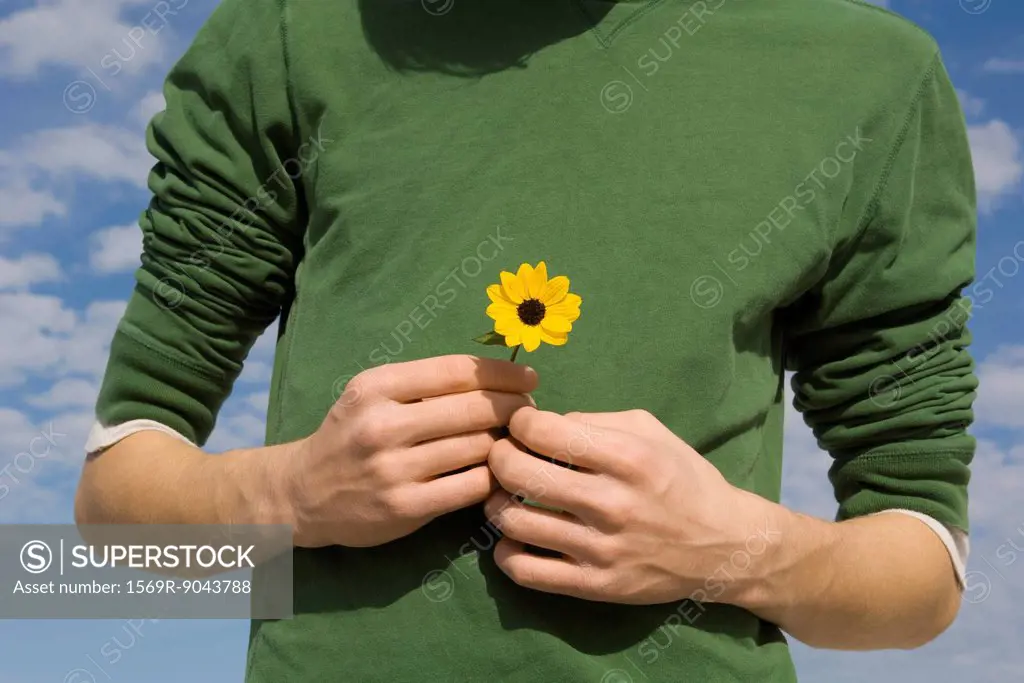 Male holding flower