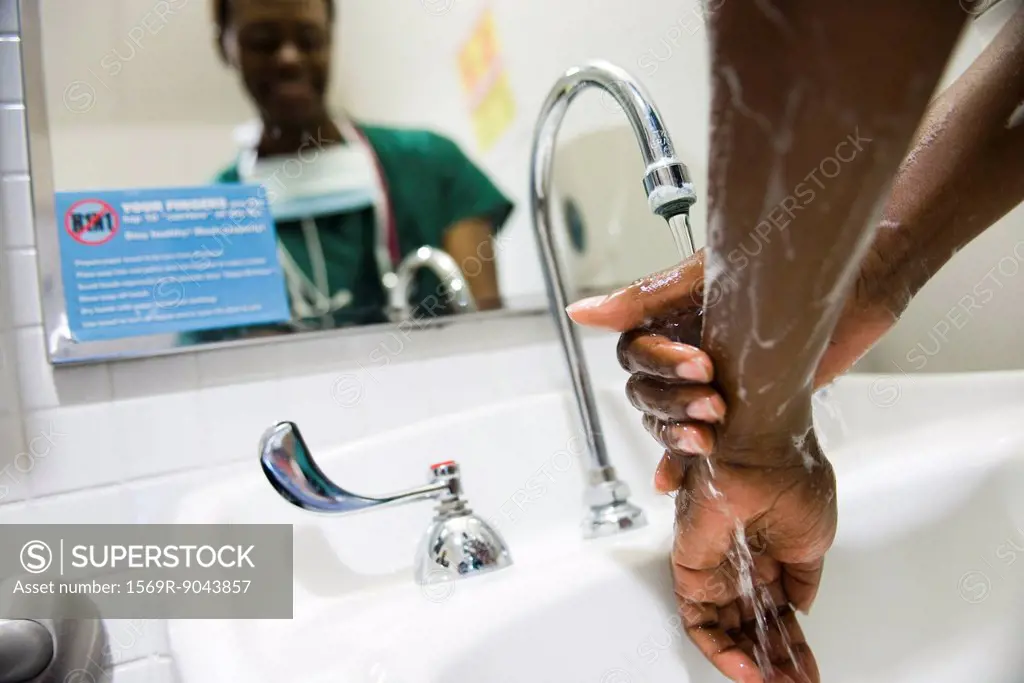 Healthcare worker washing hands