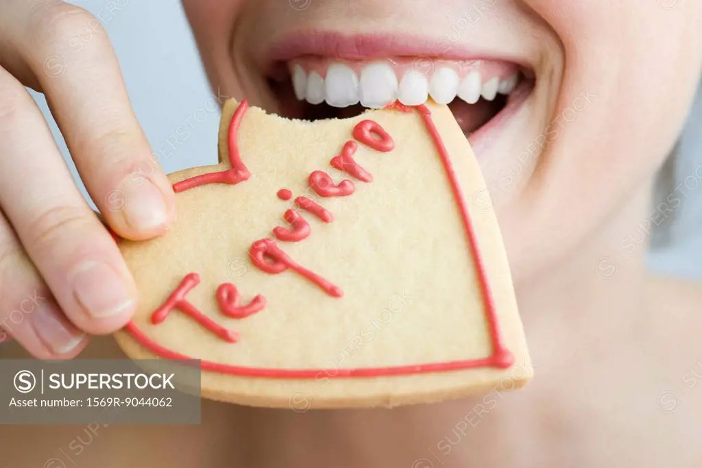 Eating heart_shaped cookie