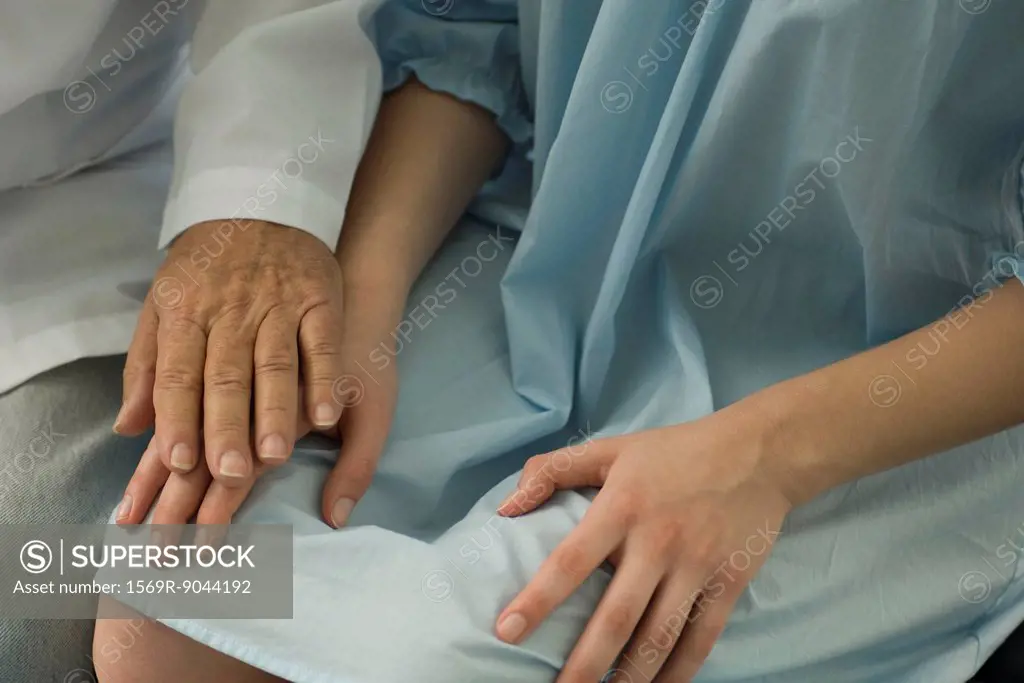 Doctor comforting patient, close_up