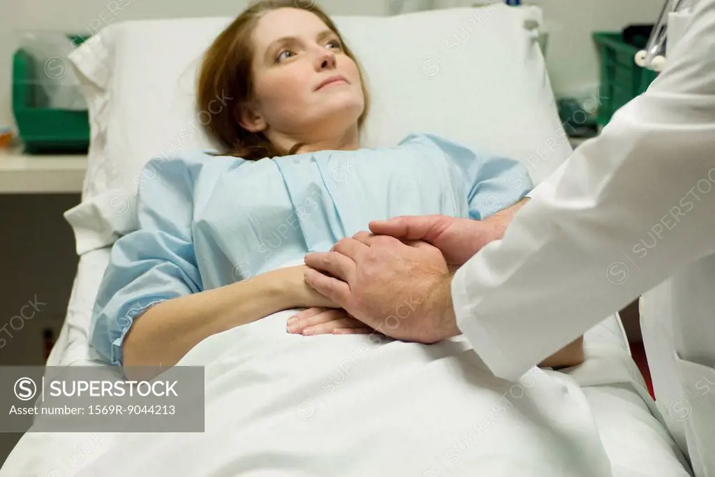 Doctor comforting patient in hospital