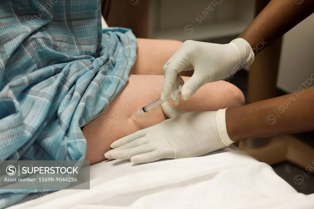 Patient receiving shot in leg