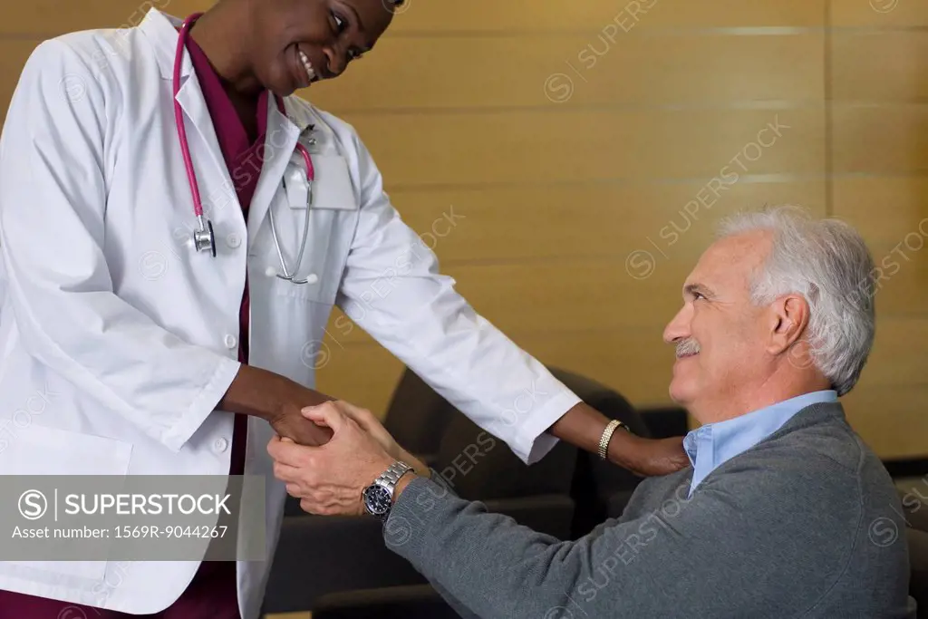 Doctor reassuring patient in waiting room