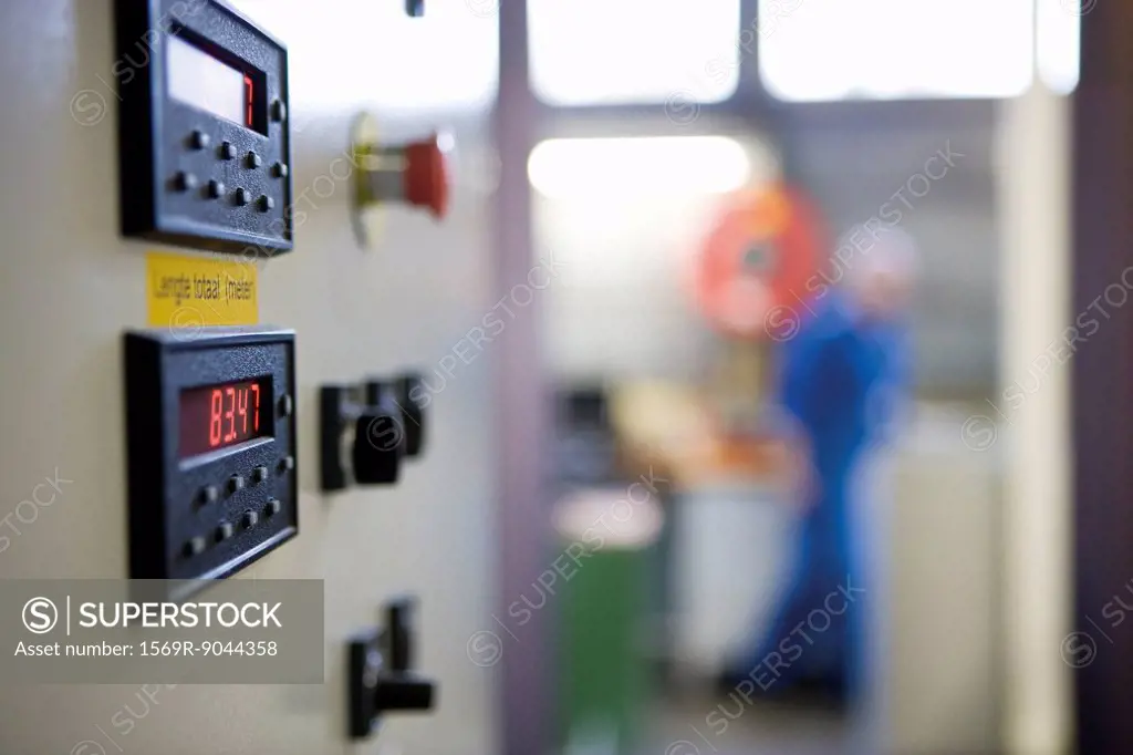 Close_up of control panel on weaving machine in carpet tile factory