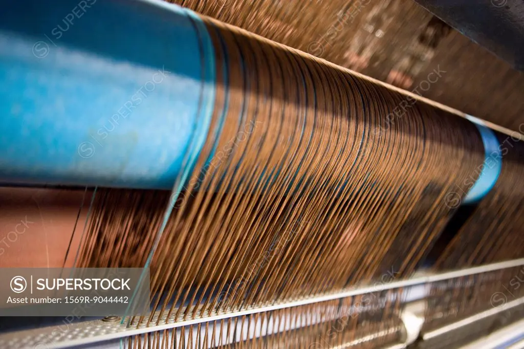 Loom weaving carpet in carpet tile factory
