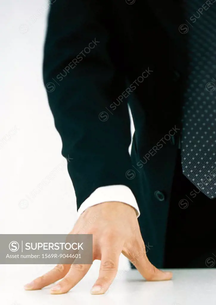 Businessman with hand on table